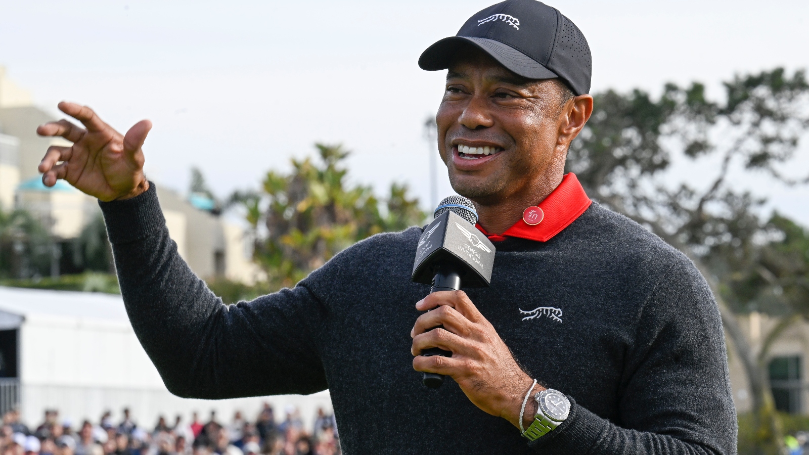 Tiger Woods speaks with reporters at the Genesis Invitational
